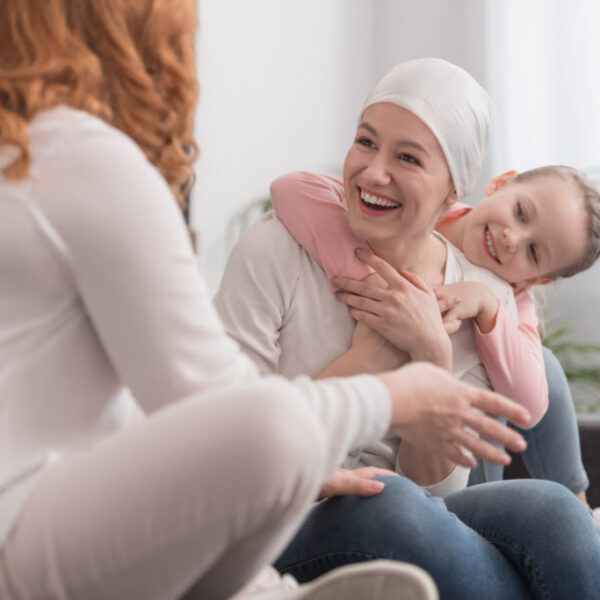sick mom with friend and child